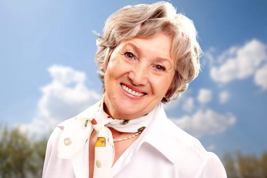 Portrait of stylish woman grey haired looking at camera