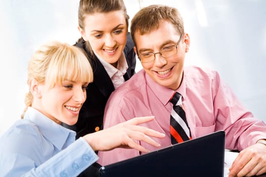 Portrait of three business people working together
