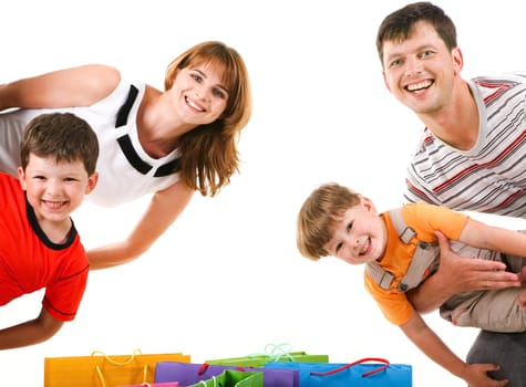 Image of cheerful family members standing looking at camera with happy expression