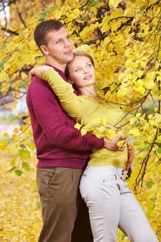 Portrait of beautiful couple embracing in autumn