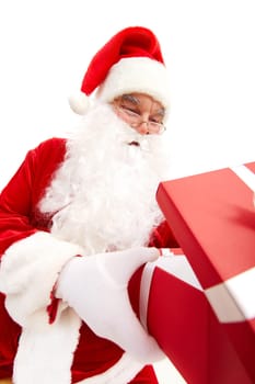 Photo of happy Santa Claus looking into red giftbox in isolation