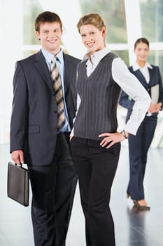 Portrait of  business people standing in a room