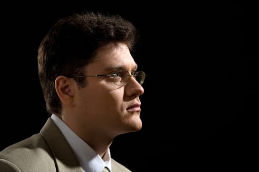 Image of modern businessman wearing glasses looking in front of him