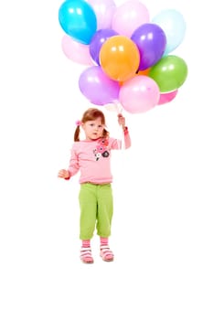Image of small girl with helium balloons at party