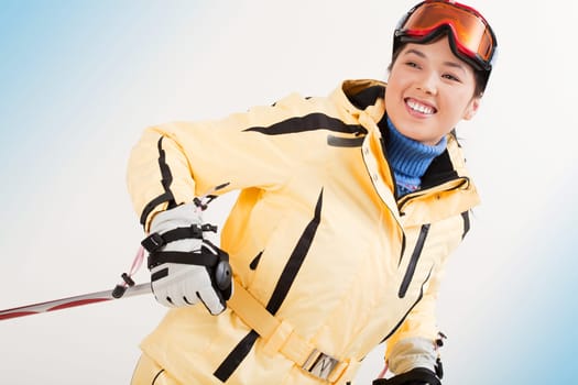 Portrait of happy sporty woman skiing
