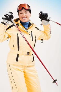 Portrait of sporty woman skiing