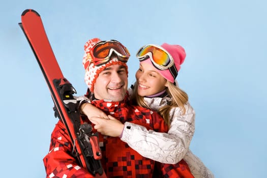 Portrait of happy female looking at sporty man while embracing him
