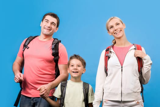 Portrait of family during rest over blue background