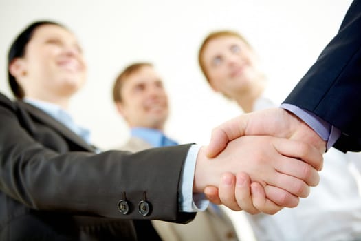Image of business partners handshake on signing contract