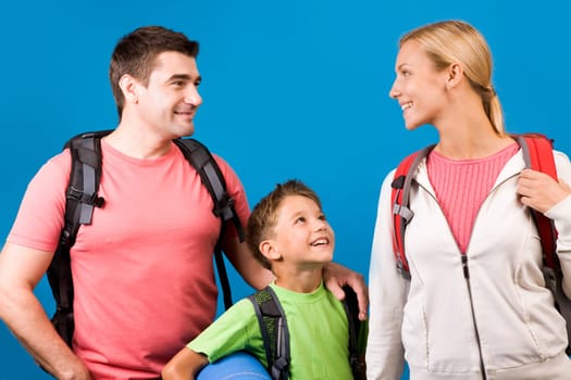 Portrait of family during rest over blue background