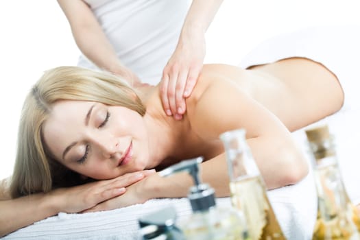 Enjoying young woman is getting a massage