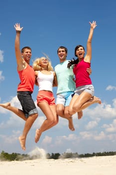 Portrait of four jumping happy people
