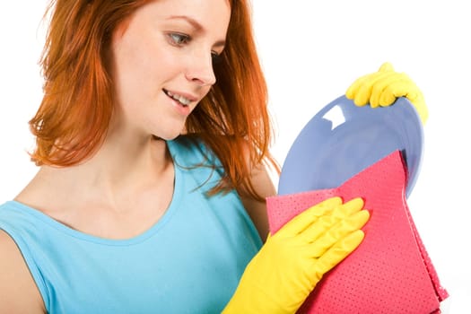 Portrait of young female holding plate and washing it