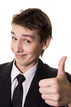 Portrait of successful male holding his thumb up and smiling