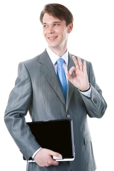 Portrait of happy businessman with laptop showing sign of okay