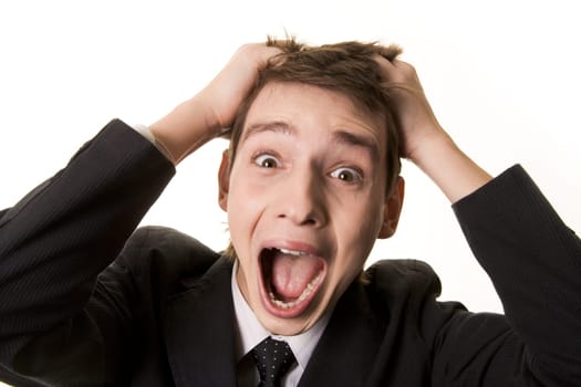 Portrait of frustrated businessman screaming while keeping his hands on head