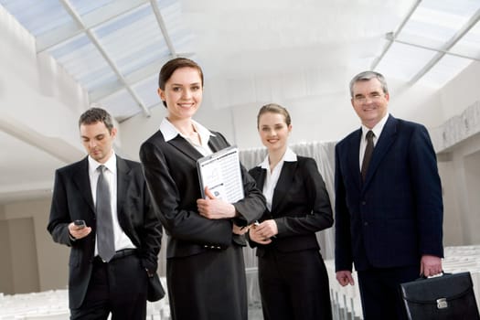 Portrait of smart business people looking at camera and smiling