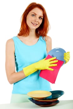 Portrait of young female holding plate and washing it
