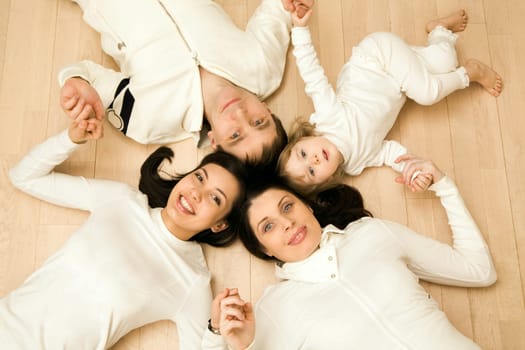 Above shot of Caucasian family consisting of father, mother, teenage and younger daughters