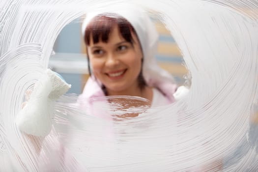 Portrait of a woman polishing glass