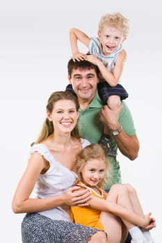 Photo of happy family of woman, man, boy and girl together