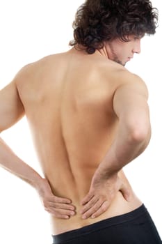 Back view of young man touching aching back
