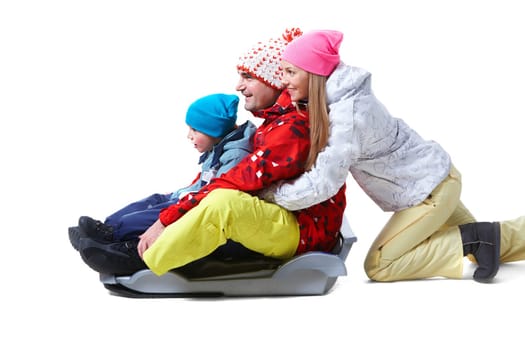 Portrait of happy family tobogganing on white background