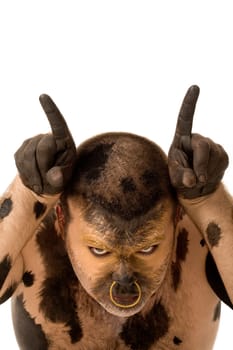 Head of painted male imagining himself being a bull and looking at camera