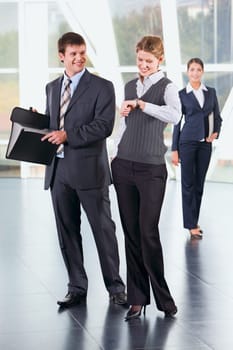 Portrait of young business people at meeting indoor