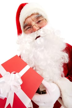 Photo of happy Santa Claus with red giftbox looking at camera