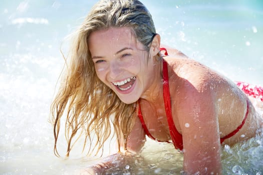 Beautiful woman having fun while swimming in the lake
