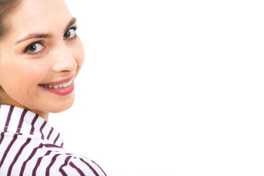 Close-up of womans face looking at camera with smile on white background