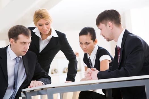 Portrait of interacting businessteam thinking about new project at meeting