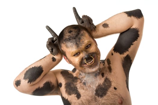 Portrait of man with body art looking at camera and smiling