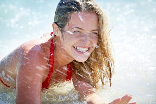 Beautiful woman having fun while swimming in the lake