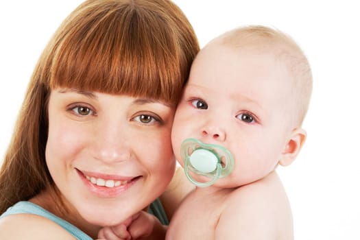 Close-up of careful mummy with her baby looking at camera on white background