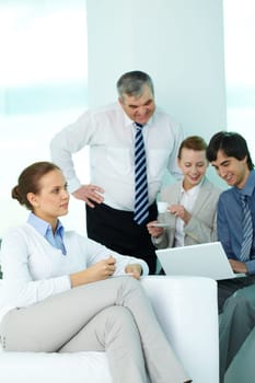 Portrait of pretty secretary having coffee in working environment