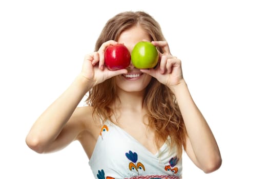 Portrait of a girl covering her eyes with apples