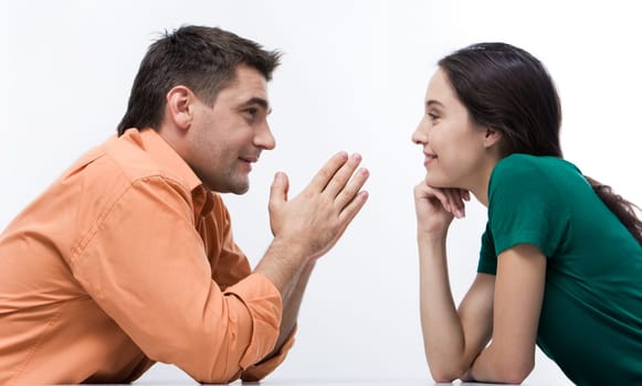 Happy couple having conversation face to face and looking at each other