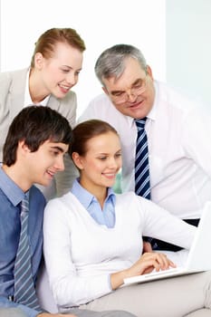 Portrait of several colleagues working through internet in office