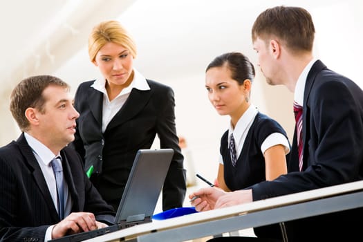 Portrait of serious people thinking of new idea and discussing it