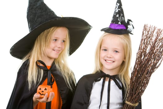 Portrait of girl twins in black hats and black clothing
