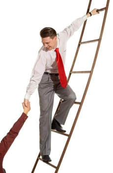 Image of confident businessman on ladder supporting man