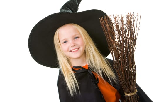 Portrait of girl in witch costume looking at camera