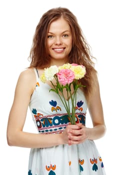 Portrait of a beautiful girl with flowers looking at camera and smiling