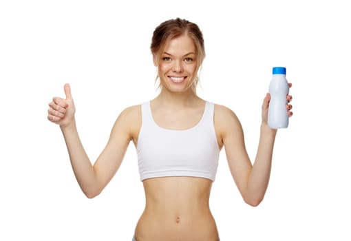 Portrait of a slim girl with a bottle of milk