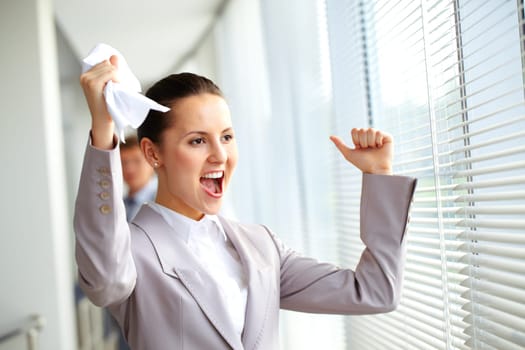 Portrait of joyful businesswoman shouting