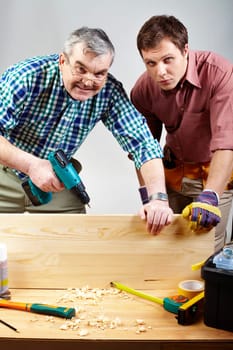 Portrait of two carpenters in workshop