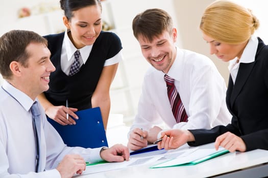 Portrait of busy people discussing new project or working plan