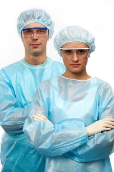 Portrait of two surgeons, a man and a woman isolated on white